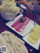 A table topped with plates of food and chopsticks.