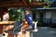 A woman in a polka dot bathing suit sitting at a bar.